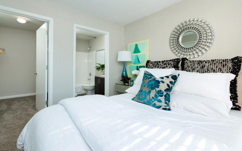 a bed with a white bed spread